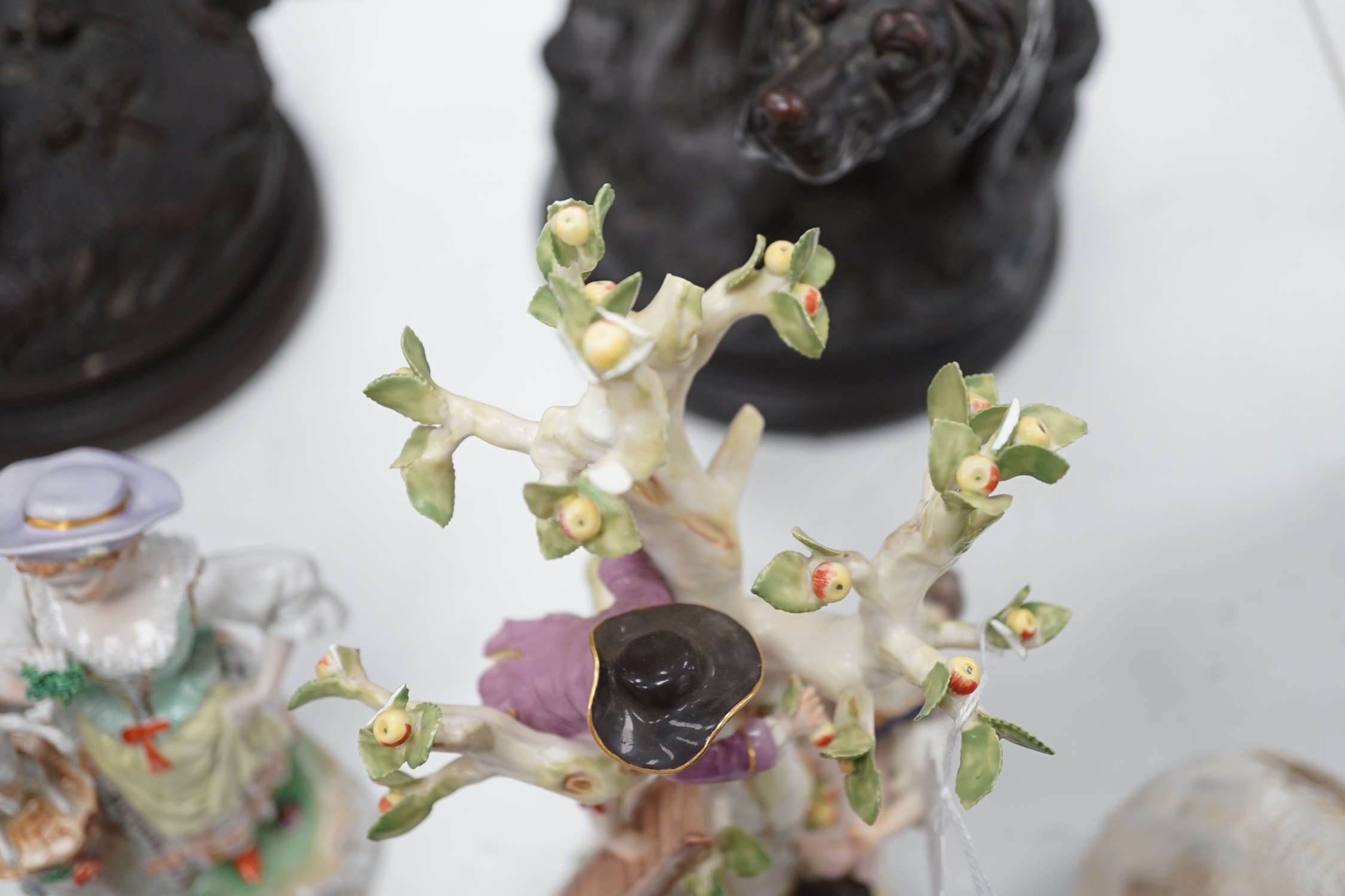 A Meissen apple pickers figure group and a pair of Dresden porcelain groups, tallest 29cm. Condition - some damage